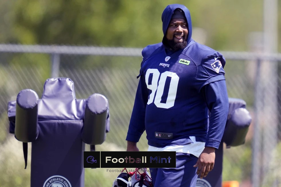 Christian Barmore watches joint practice between Pats and Eagles as he recovers from blood clots